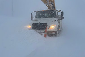 utility truck in blizzard conditions