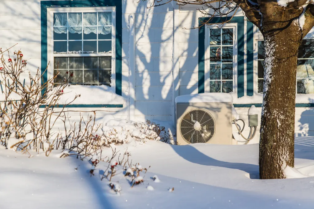 heat pump covered in snow