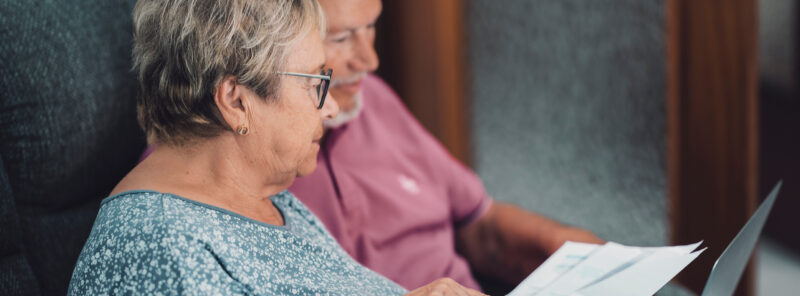 older couple looking at their bill