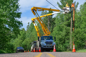 a car passes an UPPCO work zone partitioned by cones