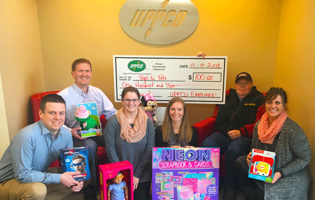 UPPCO employees of the Marquette office pose with a fraction of the company's items collected for 2018 Toys for Tots Campaign.