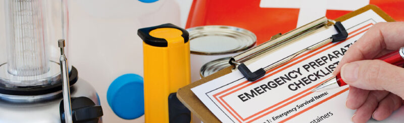 emergency preparation checklist and supplies such as radio, water, canned goods, and flashlight