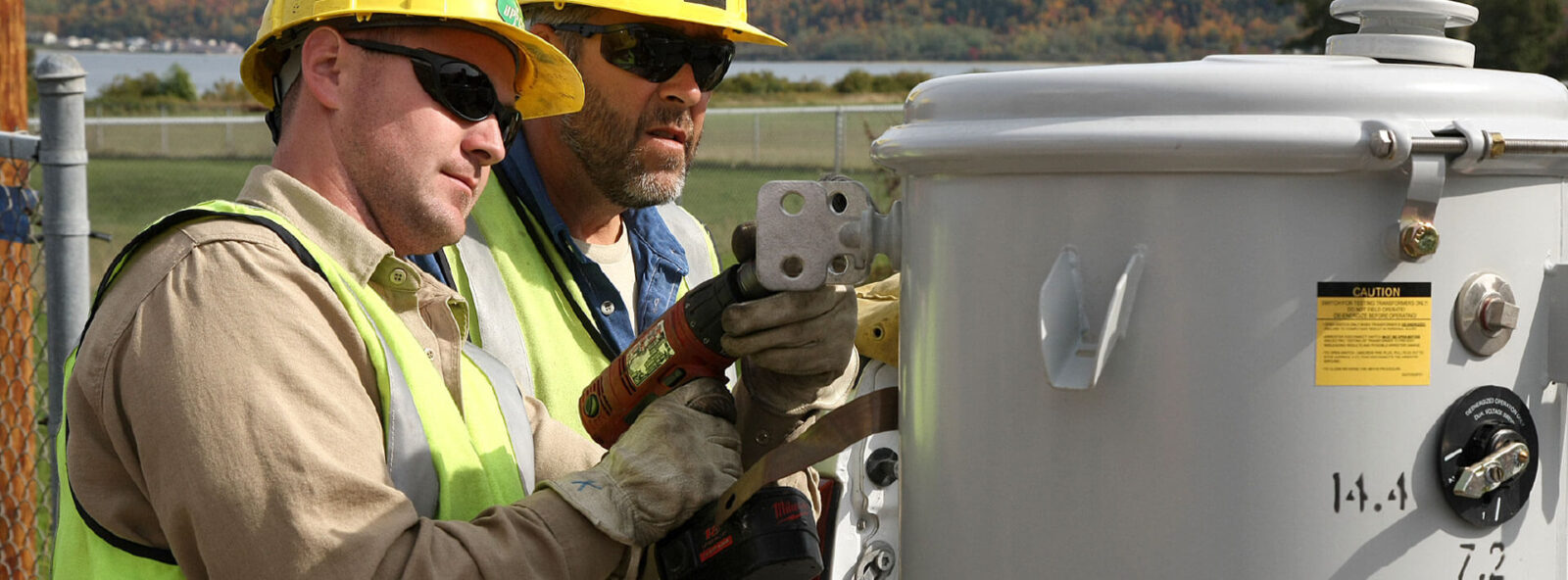crew members work on transformer